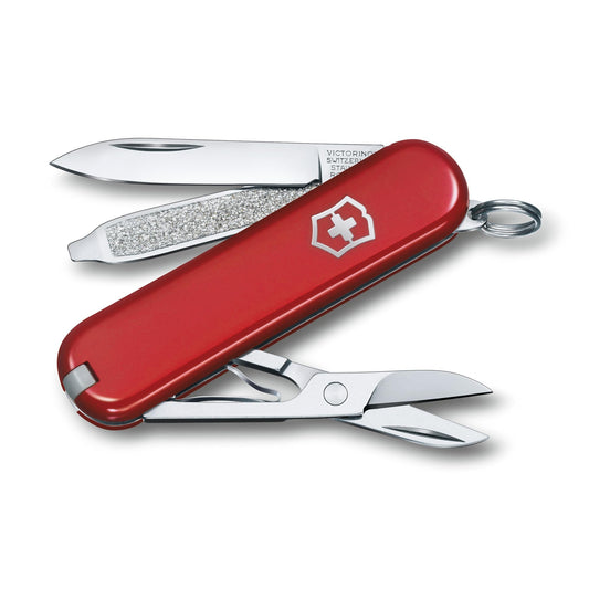 Red Victorinox Classic SD Swiss Army knife showing compact size with blade and nail file extended 